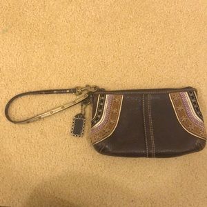 Brown leather coach wristlet